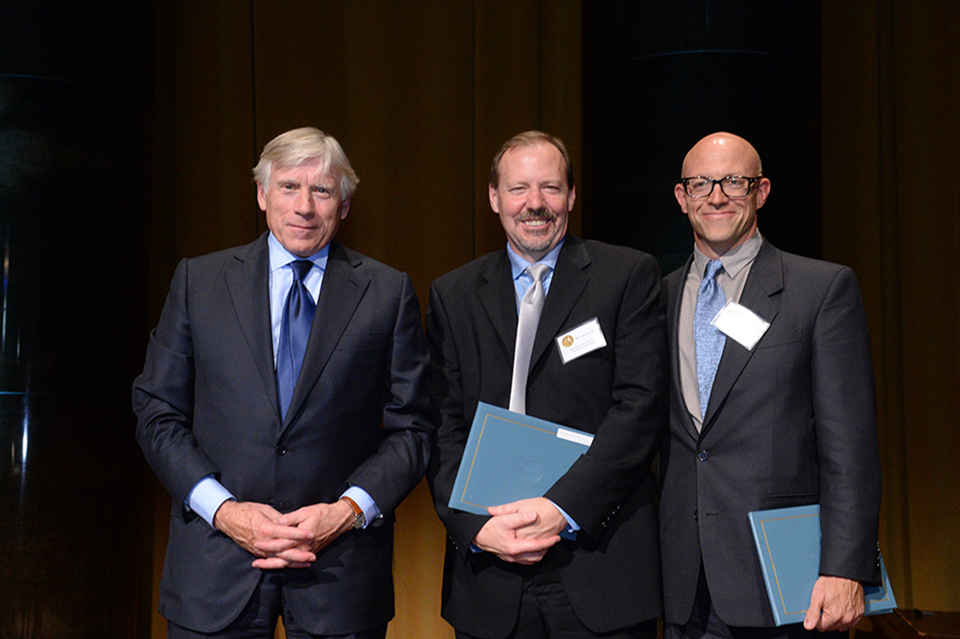 Ken Armstrong of The Marshall Project (center) and T. Christian Miller of ProPublica.