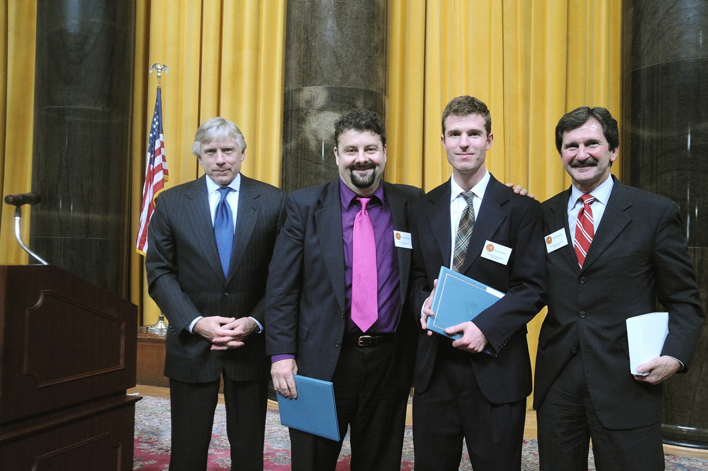 Lee Bollinger, J. Todd Foster, Daniel Gilbert and Carl Esposito