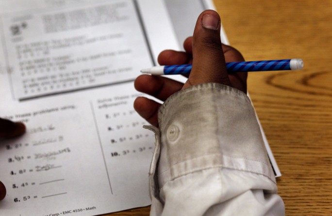 Charlie Henderson, a sixth grade student, works on math problems. Like most of the students at the school, Charlie comes from a background of poverty and neglect. His father is incarcerated, his mother is no longer around, and his grandfather recently passed away, so Charlie now lives with his grandmother. (August 25, 2013)