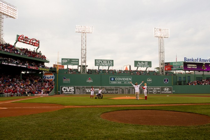 Bauman and Carlos Arredondo, the bystander who had helped him, were introduced at Fenway Park on May 28 before throwing the ceremonial first pitch for a Boston Red Sox game. (Josh Haner, The New York Times - May 28, 2013)