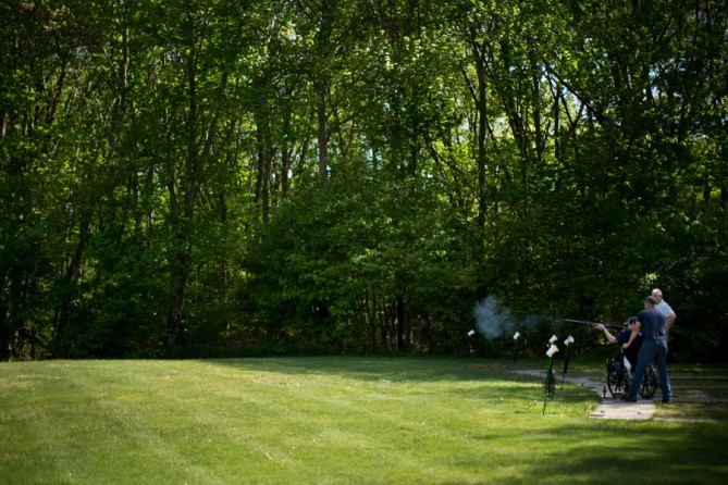 Shooting at a clay pigeon at a friend's bachelor party. "I don't know how I'm going to do with loud noises," he said beforehand. In the bomb blast, his right eardrum was blown out and his left one had a sizable hole. (Josh Haner, The New York Times - May 18, 2013)