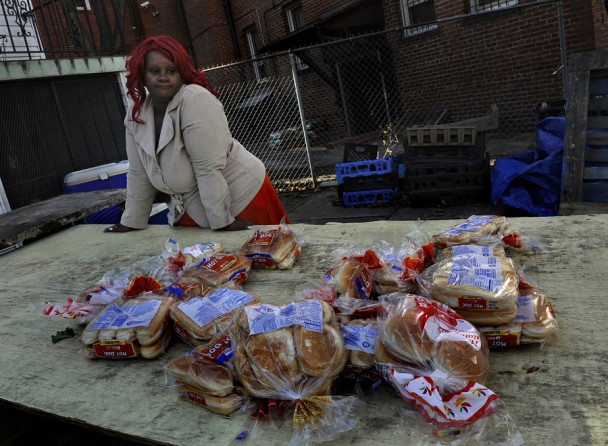 Washington, D.C.: Raphael Richmond is a bit disappointed that there was not more food available at a church food bank giveaway, but still thankful. By the time her three-hour wait in line ended, the canned goods, dairy products, fruits and vegetables were gone. She was able to get some yams, cabbage and bread. Raphael Richmond and her six children are adjusting to Congress's cuts in food stamp benefits.(December 16, 2013)
