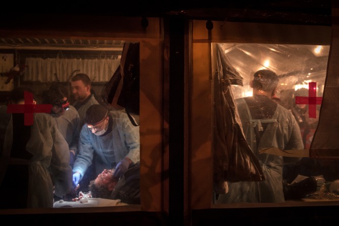 Feb. 19, 2014. Medical volunteers treat the wounded in a makeshift hospital at Independence Square in Kiev. (Sergey Ponomarev for The New York Times)