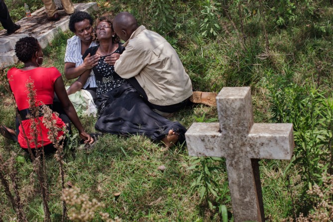 Family, friends and colleagues of Ruth Njeri Macharia, 27, at her funeral. She worked at a restaurant called Urban Gourmet Burgers. (Tyler Hicks, The New York Times - September 27, 2013)