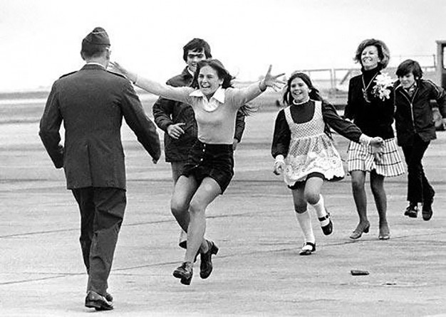 POW Col. Robert L. Stirm is reunited with his family at Travis Air Force Base in California.
