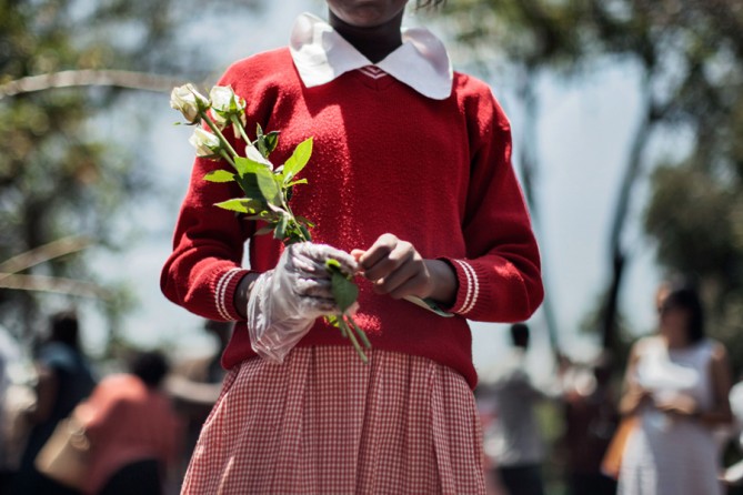 At a memorial service a month after the massacre, trees were planted in memory of those who were killed and a memorial garden was dedicated. (Tyler Hicks, The New York Times - October 22, 2013)