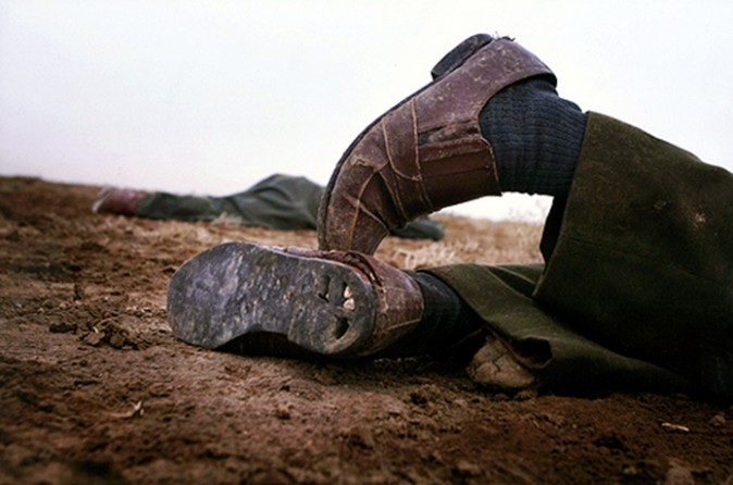 Soles on the worn-out civilian shoes of dead Iraqi soldiers tell the story of an ill-equiped army in a David-and-Goliath battle for their lives. (David Leeson)