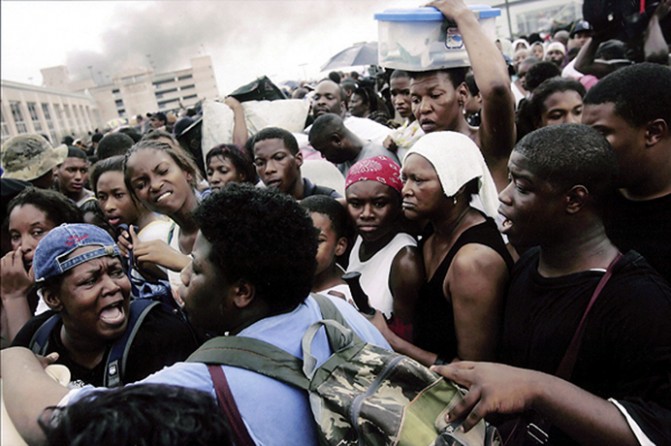 New Orleans, LA -- Evacuees at the Superdome argued in the tangled line for a bus trip to the Houston Astrodome. All over New Orleans, tempers flared as thousands waited for a way out of town, "This is a desperate SOS." -- Ray Nagin, Mayor of New Orleans. 