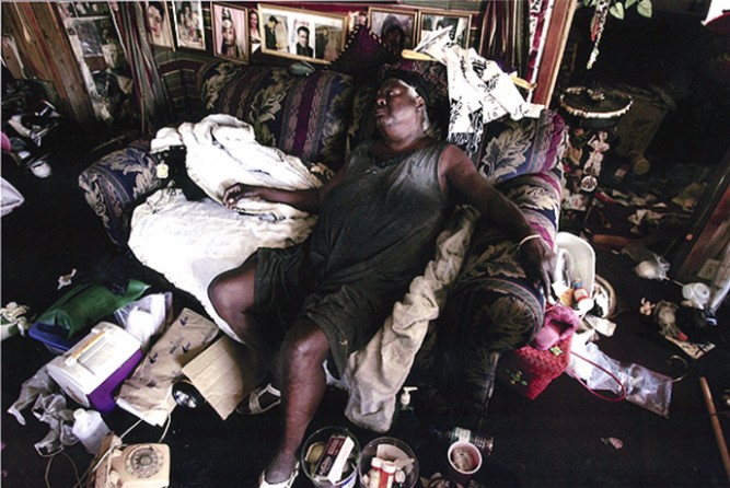 Biloxi, MS -- Eddie Mae Smith, 75, collapsed in her home, which was flooded by Hurricane Katrina and infested with mold and mildew. Bishop Nelson came to check on Ms. Smith and found her in dire condition. Nelson said he needed trailers for people such as Ms. Smith, who can't wait for FEMA aid. 