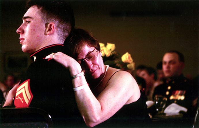 Jo Burns clings to Corporal Dustin Barker, 22, during the "Remembering the Brave" ceremony honoring the actions of fallen Marines. Corporal Barker was with Jo Burns' son, Lance Corporal Kyle Burns, when he was killed in action in Fallujah on November 11, 2004.