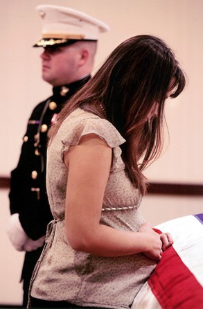 After arriving at the funeral home, Katherine Cathey pressed her pregnant belly to her husband's casket, moaning softly. Two days after she was notified of Jim's death in Iraq, she found out they would have a boy. Born on December 23, 2005, he was named James Jeffrey Cathey, Jr.