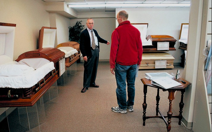 At Waters Funeral Home, Richard Jacques shows Rich the selection of caskets. Rich started to make funeral arrangements shortly before Christmas when doctors predicted Carolynne might not make it to the end of the year. (1/13/07)