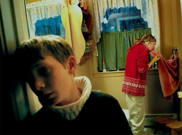 Brian stands at the bathroom while his mother cleans up after a bout of nausea. "I just see so much wear and tear on the family unit," said Carolynne's sister Sara Matters. (1/13/07)