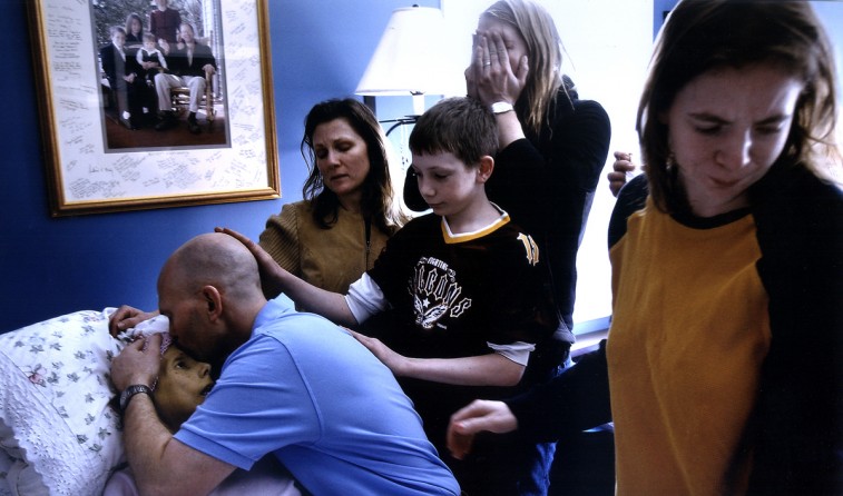 Rich kisses Carolynne the moment she passes away. Her family comforted her and held her during her final moments, as she hoped for.