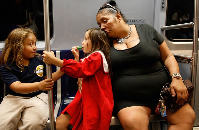 As the girls play on the way to their mother's trauma and addiction program graduation, Raquel starts to nod off from the methadone. "It's like a battle going on inside me between the methadone and the addiction; and I know I can win but it's hard," Raquel says (Jessica Rinaldi, The Boston Globe).	