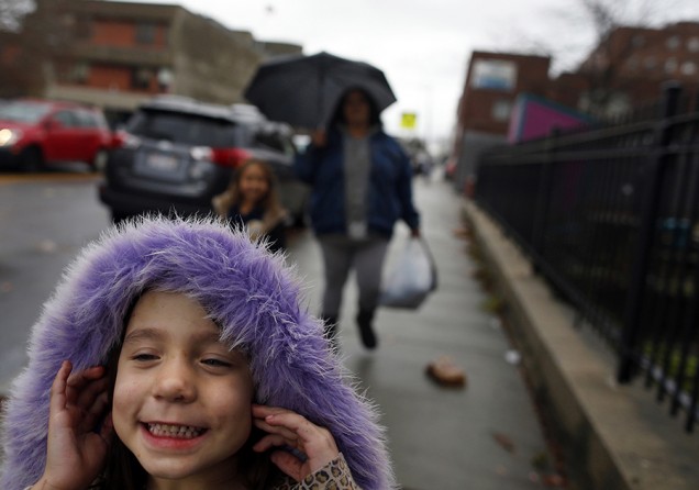 Estrella laughs as she runs ahead of her mother and sister on their walk home from school. Raquel is determined to get clean for her two young daughters. "I want them both to have a childhood that I never knew existed. Happiness, joy, love..." she said (Jessica Rinaldi, The Boston Globe).