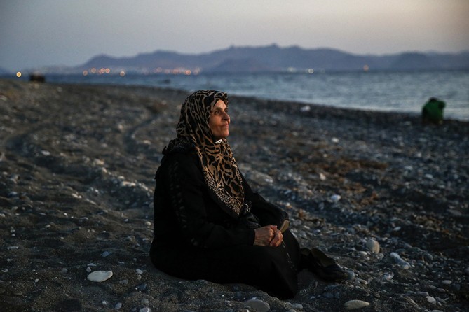 Amoun, 70, a blind Palestinian refugee who lived in the town of Aleppo in Syria, rests on a beach moments after arriving along with another forty on a dinghy in the Greek island of Kos, crossing a part of the Aegean Sea from Turkey to Greece (Yannis Behrakis, Thomson Reuters - August 12, 2015). 