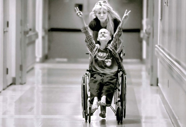 Racing barefooted after kicking off her flip-flops, Cyndie pushes her son Derek Madsen, 10, up and down hallways in the UC Davis Medical Center in Sacramento on June 21, 2005, successfully distracting him during the dreaded wait before his bone marrow extraction. Doctors want to determine whether he is eligible for a blood stem cell transplant, his best hope for beating neuroblastoma, a rare childhood cancer, which was diagnosed in November 2004.