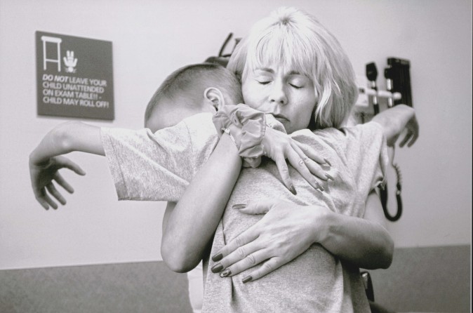 Cyndie French, embraces her son, Derek Madsen, 10, on July 25, 2005, after learning Derek needs surgery to remove a cancerous tumor in his abdomen. The emotional impact is taking its toll on her. "How can anyone maintain a nine-to-five job and do this?" she begins to wonder.