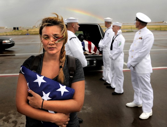Chantel Blunk, wife of Jonathan Blunk, waits on the tarmac at Denver International Airport as her husband's body is prepared to be flown to Reno, Nevada for his full military funeral. (RJ Sangosti - July 28, 2012)