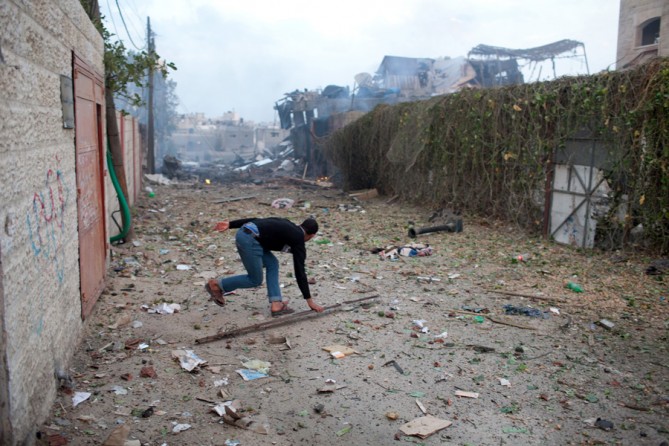 A man running for cover after an explosion in Gaza City. (November 17, 2012)
