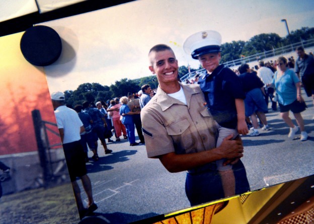 A picture of Scott holding his little brother after graduating boot camp at Paris Island, S.C., in June 2003 hangs on the refrigerator at Scott's new apartment. 'I was happy after boot camp. I knew I was going to do something. My parents were proud of me.' He talked about why he signed up. 'I had just totaled my truck. I was like, 'Do I really want to take the bus to work every day for $10 an hour and live in a crappy apartment?' I was going to end up in jail or doing drugs. So instead of going to work one 