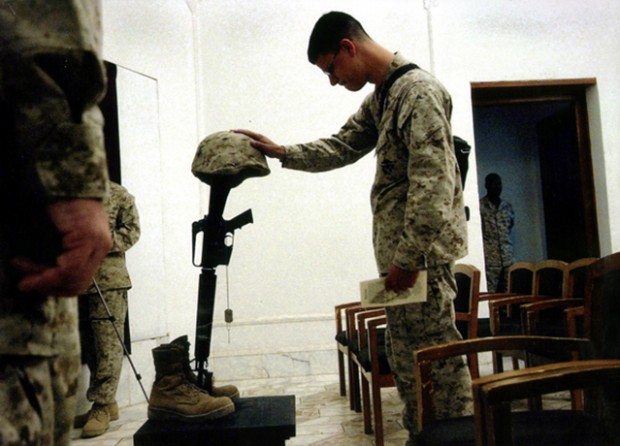 Ramadi - U.S. Marines pay their respects at a memorial service for 1st Marine Division Combat Photographer Cpl. William Salazar, 26, at Camp Blue Diamond. Salazar, of Las Vegas, Nev., was killed in action in Anbar Province.