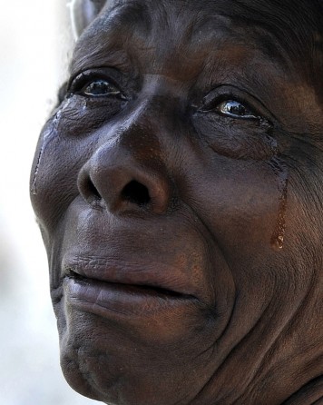 'Haiti Weeps' The earthquake’s emotional toll is etched on the faces of Haitians attending a worship service at Cathedral Notre Dame, which was destroyed in the quake. The streets were filled with beleaguered residents milling about, left with no jobs, no instructions on what to do, and no place to buy food or to take the injured. Many said they felt totally alone and saw no evidence that relief was on the way, and their mournful pleas began to give way to anger. (Carol Guzy, The Washington Post - January 2