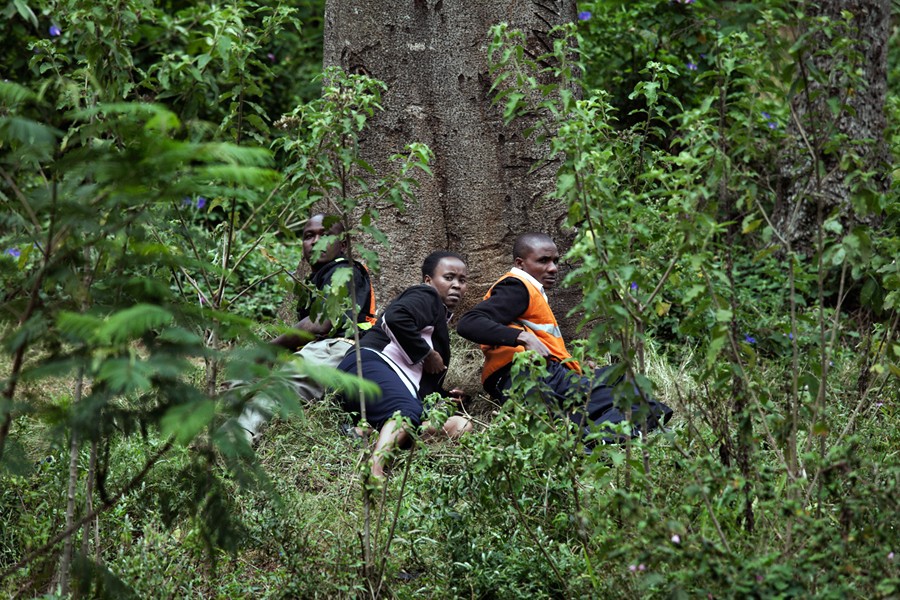 Frightened bystanders took cover in a nearby forest. (Tyler Hicks, The New York Times - September 23, 2013