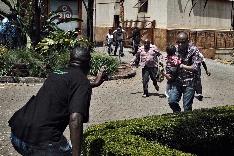 Police and security officers helped civilians escape. The mall had been criticized for lax security. (Tyler Hicks, The New York Times - September 27, 2013