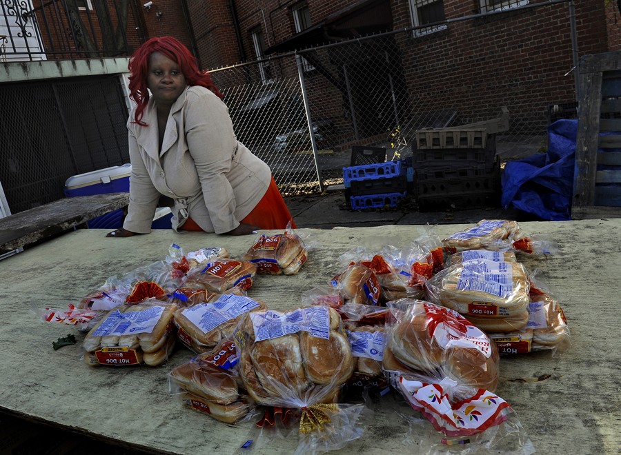 Washington, D.C.: Raphael Richmond is a bit disappointed that there was not more food available at a church food bank giveaway, but still thankful. By the time her three-hour wait in line ended, the canned goods, dairy products, fruits and vegetables were gone. She was able to get some yams, cabbage and bread. Raphael Richmond and her six children are adjusting to Congress's cuts in food stamp benefits.(December 16, 2013)