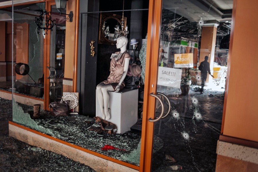 A week after the siege ended, when some shopkeepers were permitted to return, suspicions arose that the Kenyan military had looted the place. Expensive clothing was gone. (Tyler Hicks, The New York Times -  September 30, 2013)