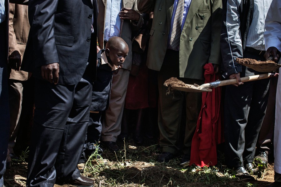 After the siege came the funerals. Simon Kamau, 4 years old, watched as his 26-year-old mother, a cashier at a supermarket in the mall, was buried. (Tyler Hicks, The New York Times - October 2, 2013)
