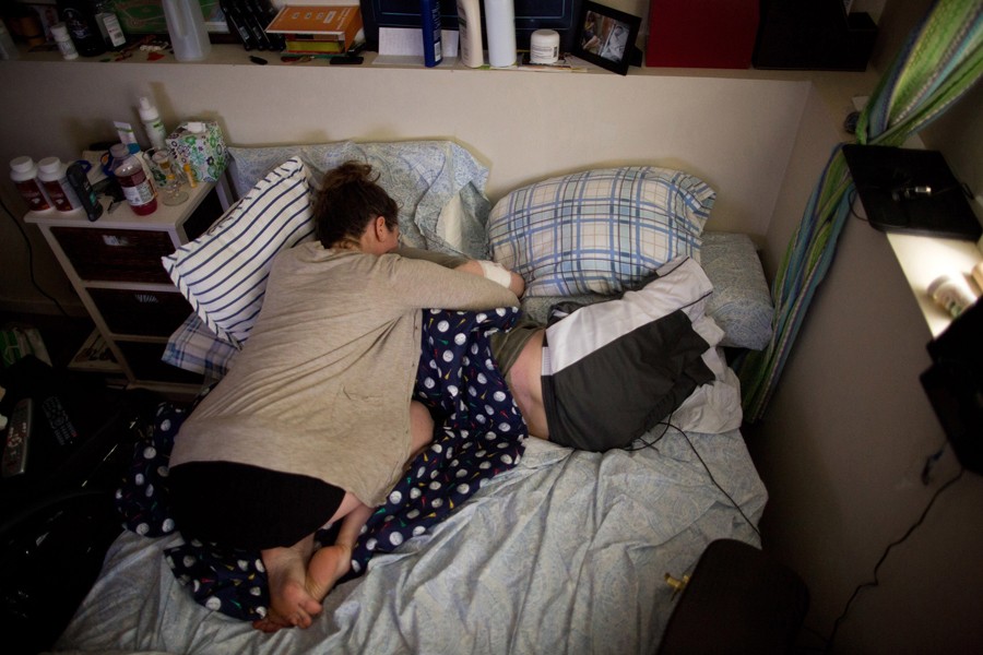 After a long day, Bauman's legs were sore when his girlfriend Erin, arrived.  She had recently started doing yoga near his house and was spending most nights sharing his bed at his mother's apartment, living out of her car. (Josh Haner, The New York Times - May 21, 2013)