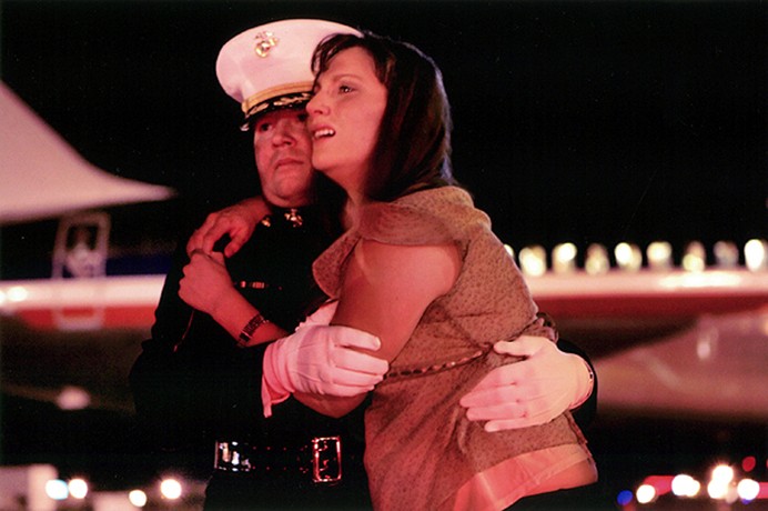At the first sight of her husband's flag-draped casket, Katherine Cathey broke into uncontrollable sobs, finding suport in the arms of Major Steve Beck. When Beck first knocked on her door in Brighton, Colo., to notify her of her husband's death, she glared at him, cursed him, and refused to speak to him for more than an hour. Over the next several days, he helped guide her through the grief. By the time they reached the tarmac, she wouldn't let go.