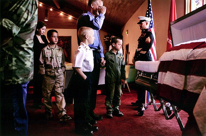 Marine Sgt. Jeremy Kocher stands watch near the body of Lance Cpl. Evenor Herrera in Eagle, as children and adults from the area poured in to pay their respects. Like many of the Marines stationed at Buckley Air Force Base in Aurora, Kocher says the funeral detail is the most difficult mission he's ever done. "I actually start thinking about it the moment I wake up. It's such an important job that I just don't want to mess it up," he said. "I just want it to be perfect."