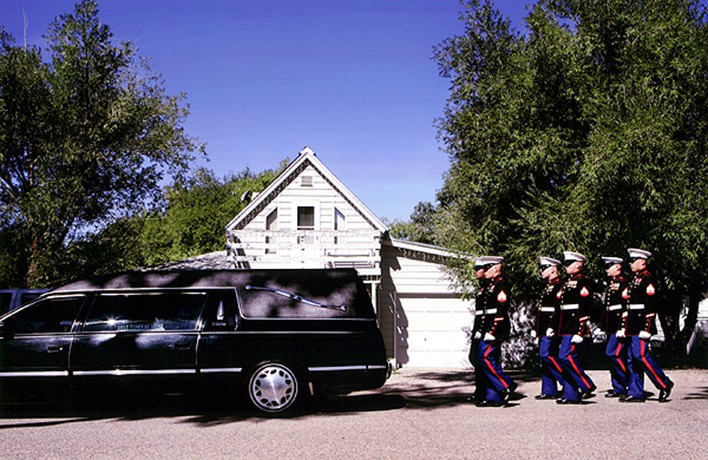 Members of the Marine Air Control Squadron 23 stationed at Buckley Air Force Base escort the casket of Marine Lance Corporal Evenor Herrera through the town of Eagle, Colo., to his gravesite. Since the beginning of the war, Marines from Buckley have overseen funerals for 18 active duty Marines; 14 died in Iraq, four died in traffic accidents.