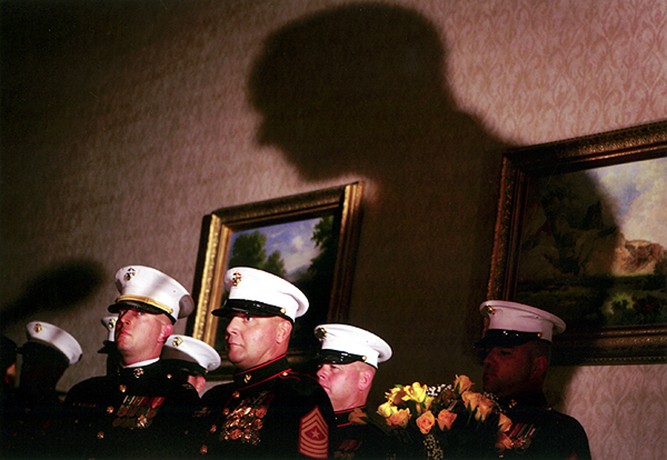 During the formal ceremony, called "Remembering the Brave," which was held at a Holiday Inn in Denver, Captain Chris Sutherland, left, Sergeant Major Jeff Study, Staff Sergeant Clifford Grimes and Gunnery Sergeant Todd Martin prepare to deliver posthumous medals to the families of fallen Marines. They also presented each family with a vase of yellow roses -- one rose for each year of the Marine's life.