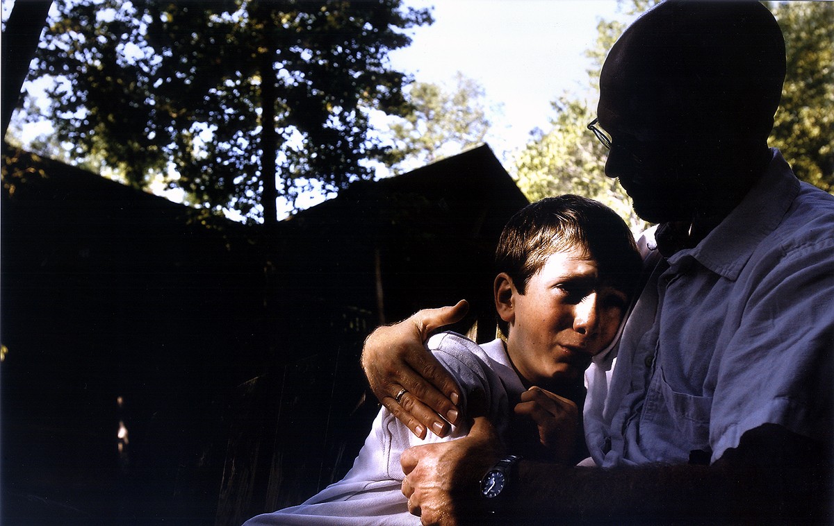 Sitting on a swing outside his new boarding school in South Carolina, Brian cries while saying goodbye to Rich. Brian told Rich he didn't want him to leave. Rich tried to assure him that a year in therapeutic boarding school would make him stronger and help him deal with grief. (12/9/07)