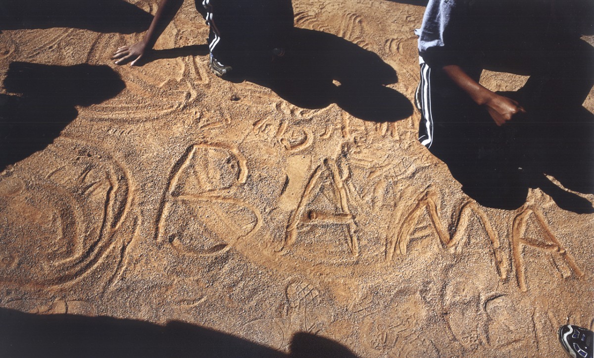 Children inscribe a favorite at an Obama rally at Ed Smith Stadium in Sarasota, Fla.