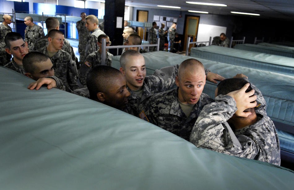 From left, recruits Rob-drick Robinson, Fisher and Christopher Wegner talk with Fisher’s bunkmate about his behavior June 23, 2007.  He had been consistently causing problems, and the rest of the platoon was paying the price.  Because of the culture of basic training, where all suffer for the faults of one, recruits often police their own ranks.  Fisher said he worried that the pep talks for his bunkmate might not be enough but he wouldn’t be part of any physical confrontation.  "I told him I’d be ther
