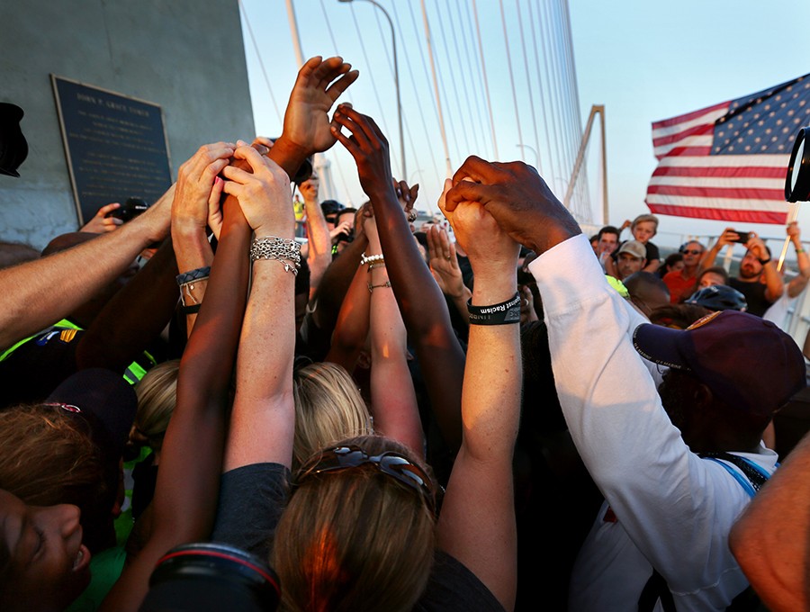 “Charleston strong” wasn’t just a phrase as nearly 15,000 people link hands for the Bridge to Peace Unity Chain on the Arthur Ravenel Jr. Bridge over the city's harbor. The event aimed to show the community's solidarity and unity four days after a white gunman killed nine black worshippers at Emanuel AME Church, a tragedy that threatened to divide the city along racial lines (Grace Beahm, The Post and Courier - June 21, 2015).