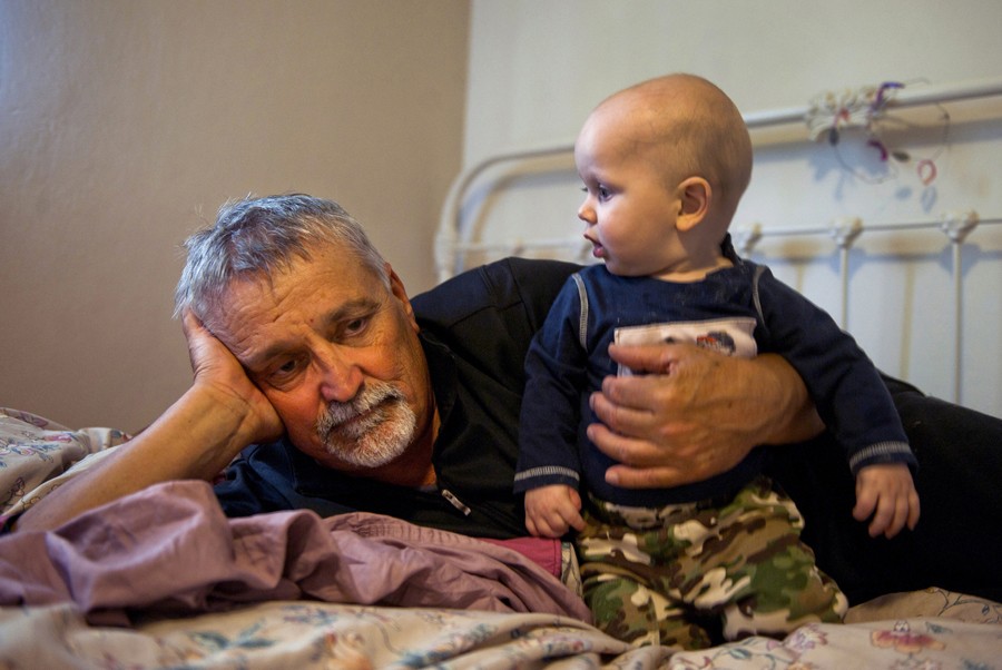 Don Hatfield, 64, snuggles his grandson Alex, the youngest of the three children of his daughter Rachel Winkler who was killed Feb. 27, 2012 in her Cameron Park, Calif., home. Rachel's husband, Todd Winkler, has been charged with her murder.  Already suffering from the loss of his beloved wife Janey to cancer, Hatfield filed for custody of his grandchildren and has just spent his first night tending to 9 month-old Alex in a new rental home in Napa, Calif. (March 17, 2012)