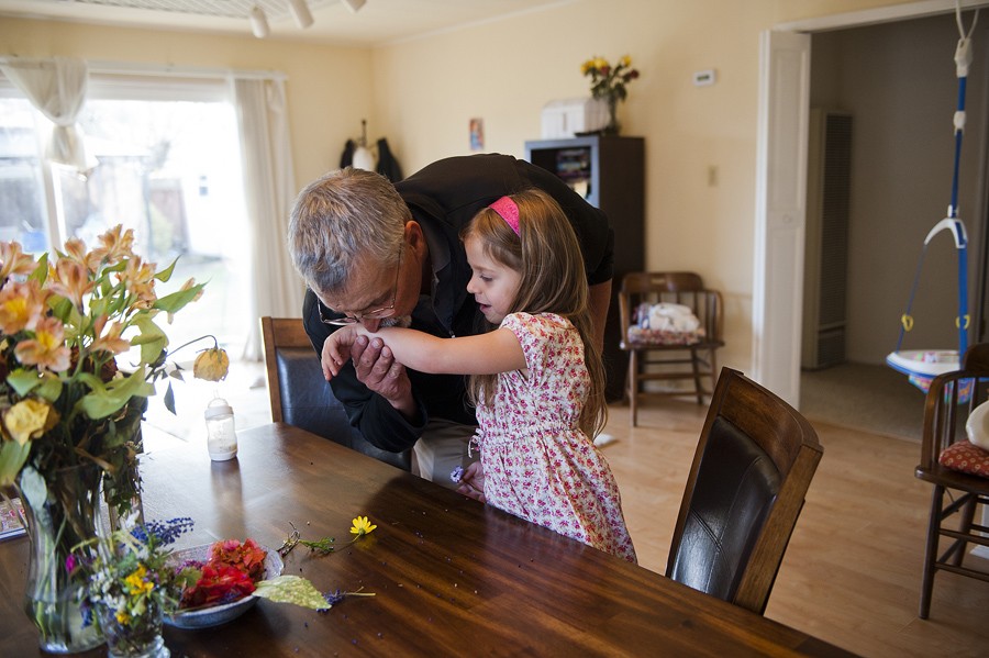 Don Hatfield gives his granddaughter Eva, 4, a kiss before heading out to run errands. (April 6, 2012)