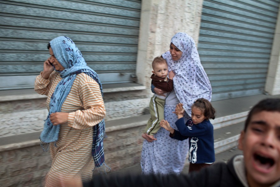 A terrified family being evacuated from their Gaza City apartment moments after bomb from an Israeli jet exploded nearby. (November 19, 2012)