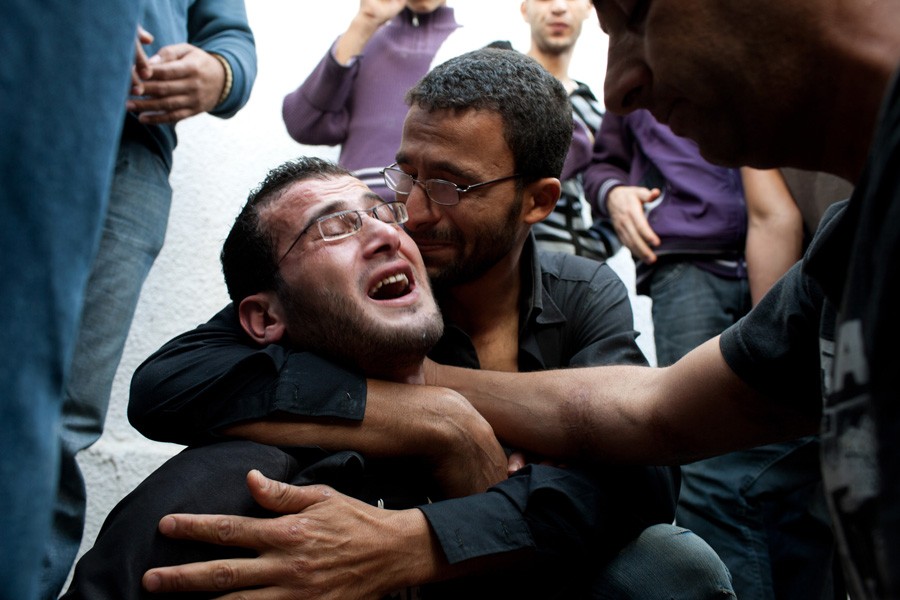 Mourners at the funeral for the Dalu family. Nine members of the family, from three generations, were killed when an Israeli bomb struck their home in Gaza. (November 19, 2012)