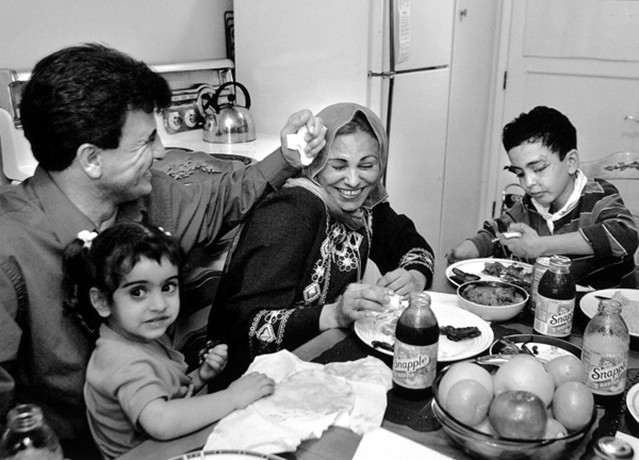 As they settled into their apartment in Oakland, Hadia prepared meals for the family. Raheem, with daughter Marwa in her rightful place at the center of daddy's universe, gave Hadia a playful nudge when she said he looked funny without his mustache.