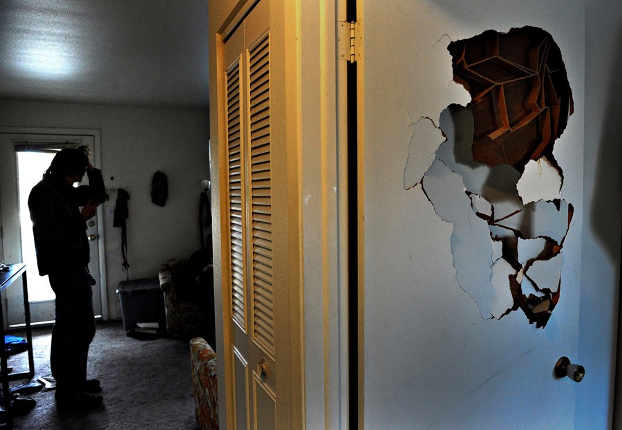 After punching a hole in his bedroom door, Scott panics in his living room. 'My PTSD comes from long exposure to combat trauma,' Scott said. 'I think it comes from the fact that I survived. That wasn't my plan. It's an honor to die for my country, but I made it home.' Scott said that being diagnosed with PTSD 'means I have nightmares every night. It means I'm hyper-vigilant -- It means I have no fuse and if I get attacked, I'm going to kill. 'I don't want to feel this way.' (Craig Walker, The Denver Post - 