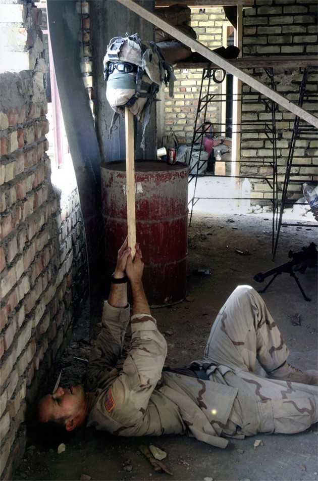 Najaf - A U.S. soldier uses a dummy to draw an insurgent sniper into view. 