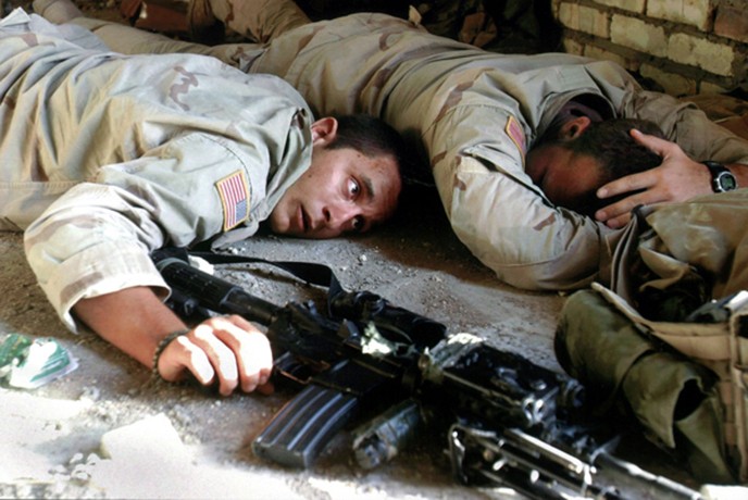 Najaf - U.S. soldiers take cover in a fortified position after a second week of fighting against Shiite militiamen in the holy city. 